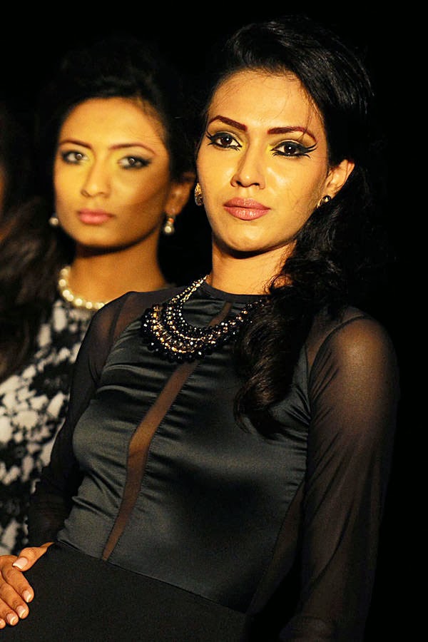Models displays creations by fashion designer Oshini at the annual HSBC Resort fashion week in Galle on October 6, 2013. 
