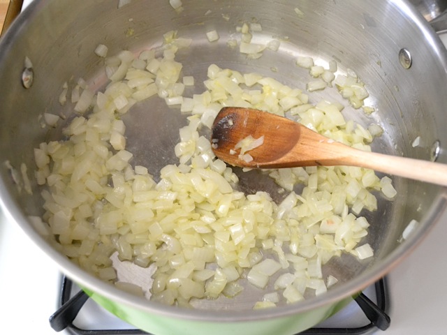 onions and garlic in pot cooking 