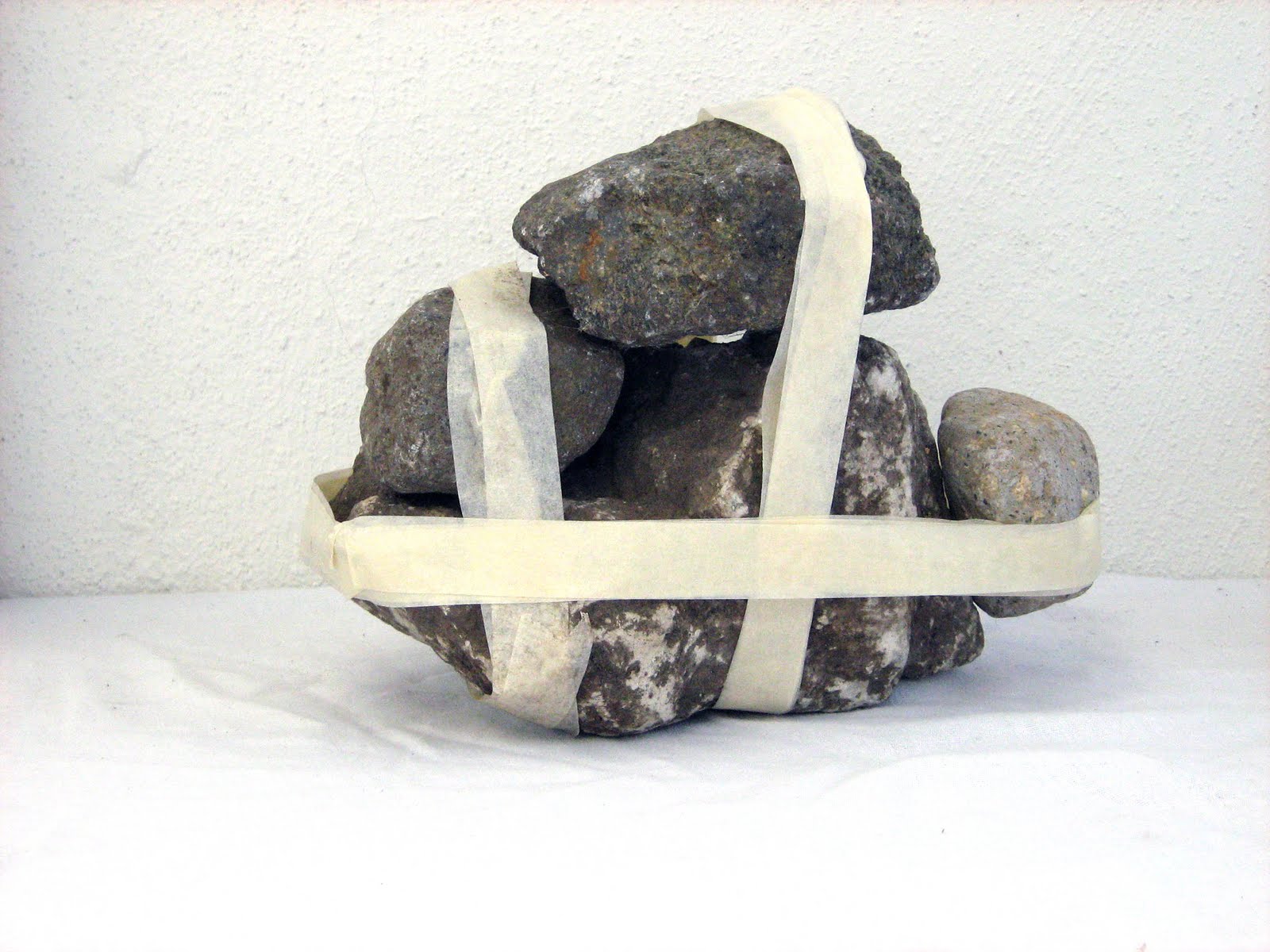 Stones tied with masking tape (IV)