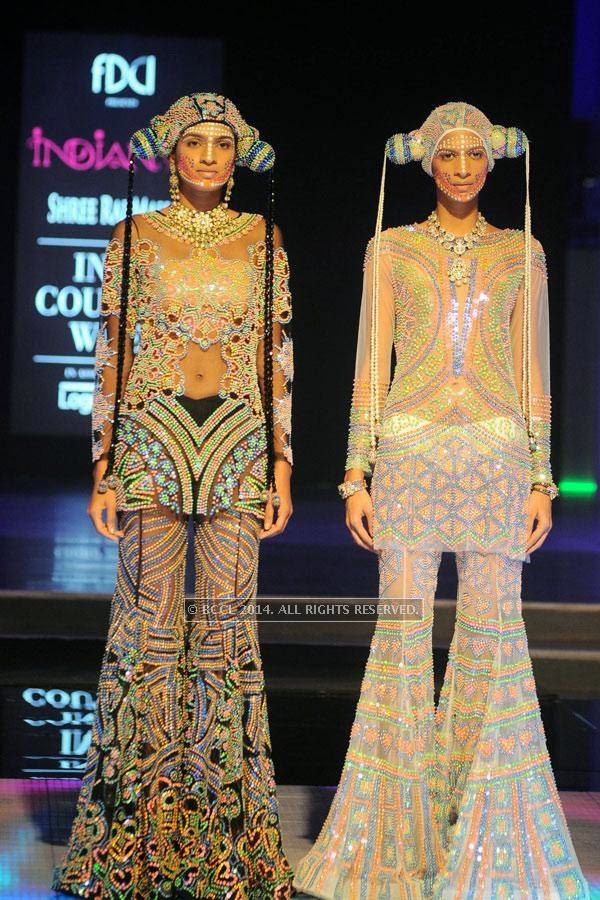 A model showcases a creation by designer Manish Arora on Day 3 of India Couture Week, 2014, held at Taj Palace hotel, New Delhi.