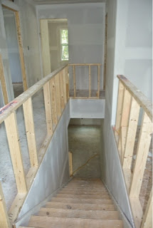 Ryan Homes Florence Model stairway between first and second floors just after drywall installed Picture of the stairway between first and second floors just after drywall installed
