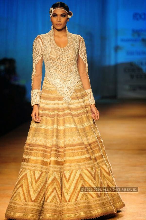 A model walks the ramp for Rimple and Harpreet on Day 6 of India Couture Week, 2014, held at Taj Palace hotel, New Delhi.