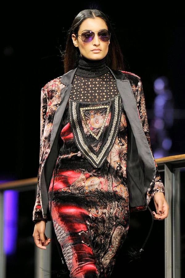 A model presents a creation by Custo Barcelona during the 080 Barcelona Autumn-Winter 2014-2015 fashion week in Barcelona on January 29, 2014.