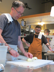 Caprial + John: Modern Pot Pie cooking class dicing an onion