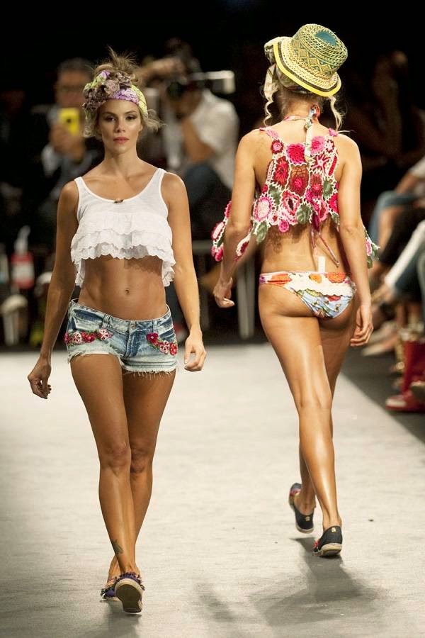 Models present creations by Colombian brand Agua Bendita during the Colombiamoda fashion show in Medellin, Antioquia department, Colombia, on July 23, 2014.