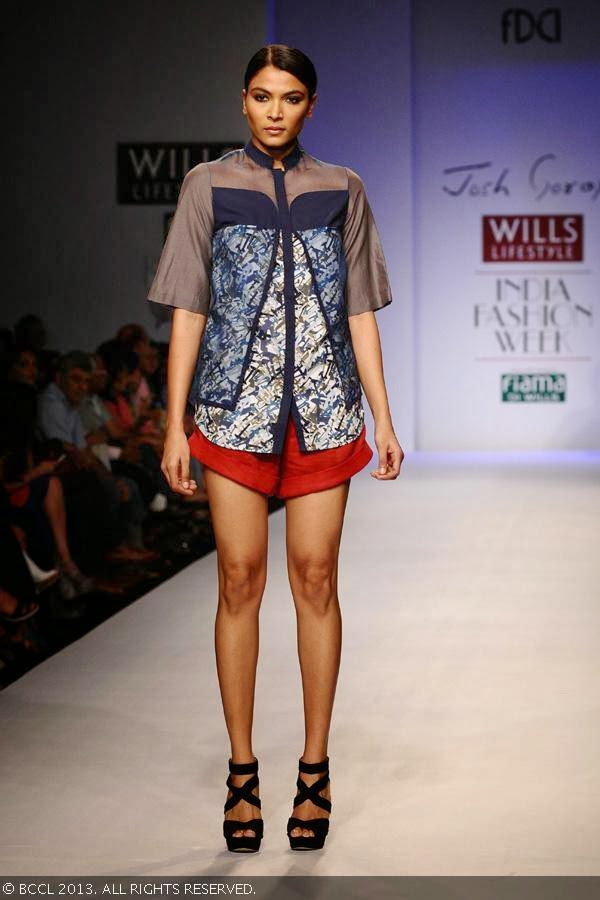A model showcases a creation by fashion designer Josh Goraya on Day 5 of Wills Lifestyle India Fashion Week (WIFW) Spring/Summer 2014, held in Delhi.<br /> 