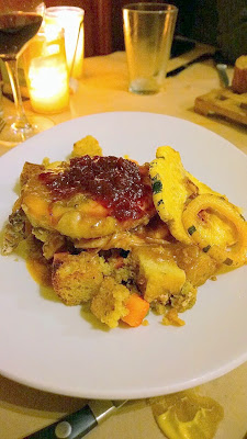 Entree at our Thanksgiving Dinner at the girl & the fig of Roasted Turkey Roulade with cornbread stuffing, delicata squash, spiced cranberry sauce and pan gravy