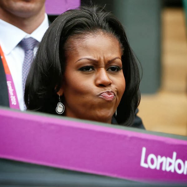 U.S. first lady Michelle Obama reacts during the women's singles tennis match between Serena Williams of the United States and Jelena Jankovic of Serbia at the All England Lawn Tennis Club during the London 2012 Olympics Games.