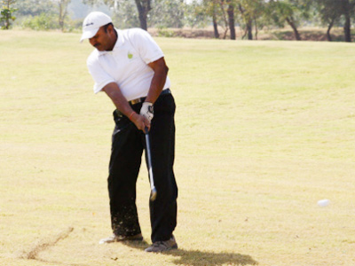 IPS officer Manoj Agarwal swinging at the Kensville golf course, at the inauguration of the Kensville golf club, off Ahmedabad.