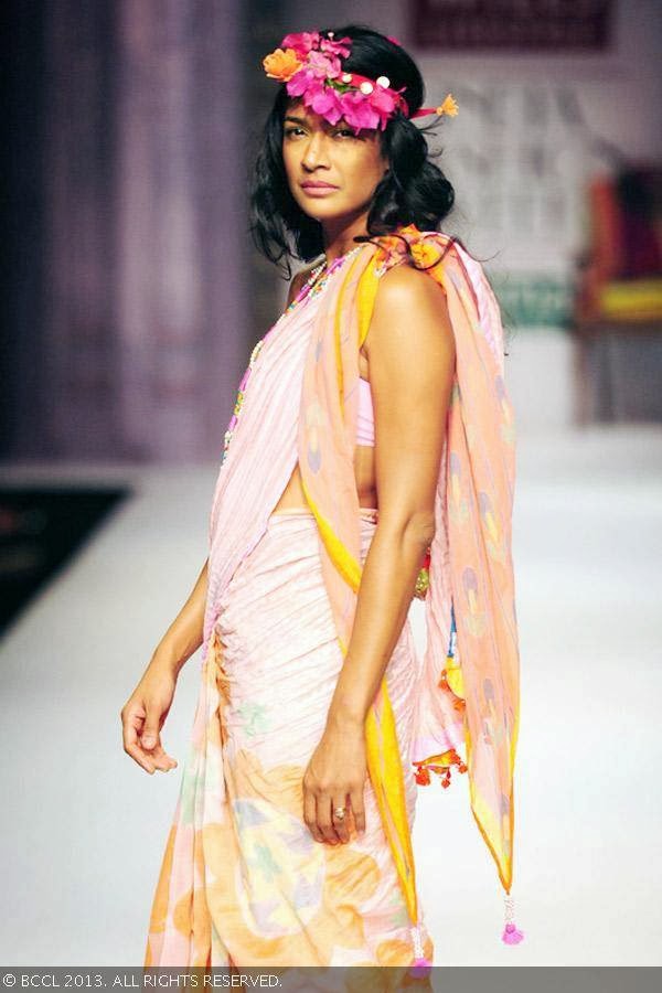 Carol Gracias showcases a creation by fashion designer Anupama Dayal on Day 1 of Wills Lifestyle India Fashion Week (WIFW) Spring/Summer 2014, held in Delhi.