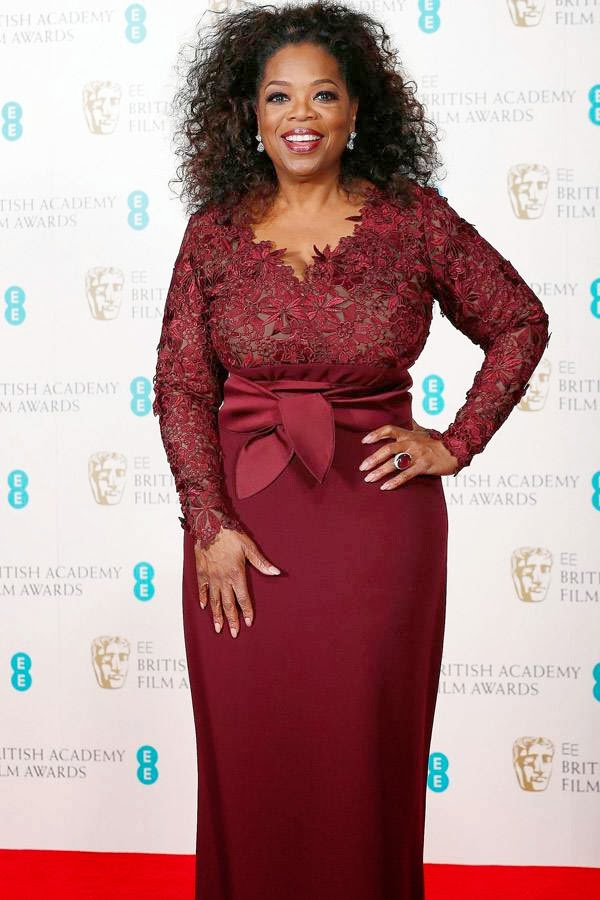 Citation reader Oprah Winfrey poses in the Winner's Area at the British Academy of Film and Arts (BAFTA) awards ceremony at the Royal Opera House in London on February 16, 2014.