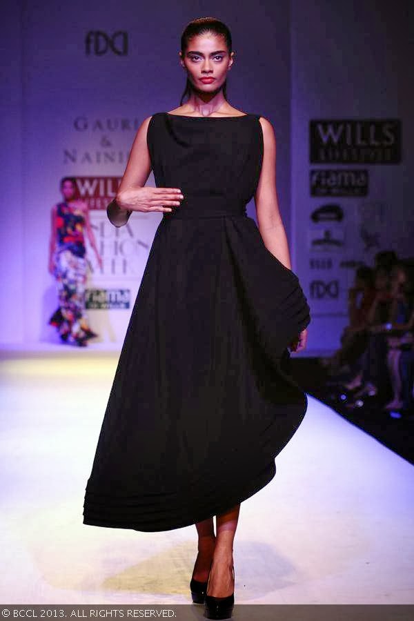 Archana walks the ramp for fashion designers Gauri and Nainika on Day 1 of the Wills Lifestyle India Fashion Week (WIFW) Spring/Summer 2014, held in Delhi.