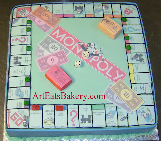 Unique Monopoly board game birthday cake with edible money, dice, and silver playing pieces