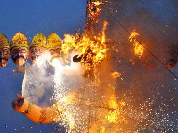 An effigy of demon king Ravana burns during Dussehra celebrations, on October 13, 2013. 