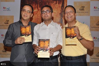 (L-R) Vidhu Vinod Chopra with author Rahul Pandita and Vir Chopra seen during a photo op at the launch of Rahul's latest book 'Our Moon Has Blood Clots', held at Title Waves Book Store in Mumbai on February 4, 2013. (Pic: Viral Bhayani)