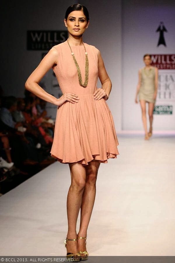 A model showcases a creation by fashion designer Vedangi Agarwal on Day 5 of Wills Lifestyle India Fashion Week (WIFW) Spring/Summer 2014, held in Delhi.