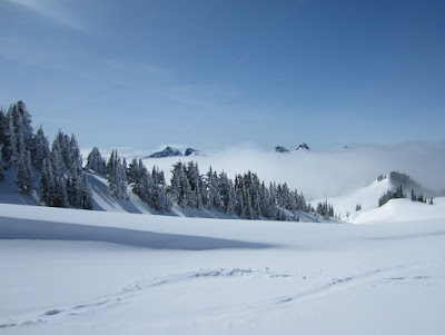 Tatoosh peak poking through the clouds - Unicorn, Castle, Pinnacle