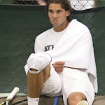 Spain's Rafael Nadal sits at the side of the court after a practice session on the eve of the start of the Wimbledon Championships tennis tournament at the All England Tennis Club in Wimbledon, southwest London, on June 24, 2012. AFP PHOTO / MIGUEL MEDINA   RESTRICTED TO EDITORIAL USE        (Photo credit should read MIGUEL MEDINA/AFP/GettyImages)