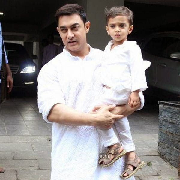 Aamir Khan poses with Azad Khan pose for the camera during Eid celebration at his residence in Mumbai, on July 29, 2014.(Pic: Viral Bhayani)