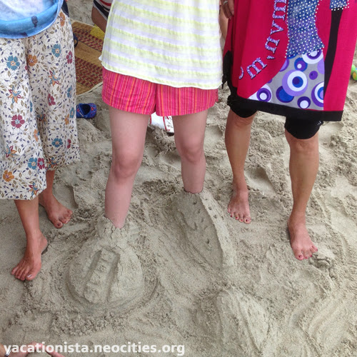 Legs buried in the sand