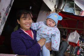 a woman holding a baby in Changsha, China
