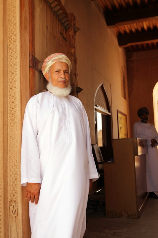 Elderly Omani Man at the entrance of Jabreen Castle, Oman