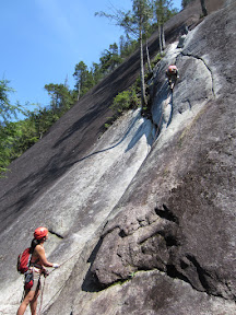 Colleen belays Sara up the start of pitch 1 (5.7).  The hardest move is the start in trying to gain the crack which Sara has just accomplished