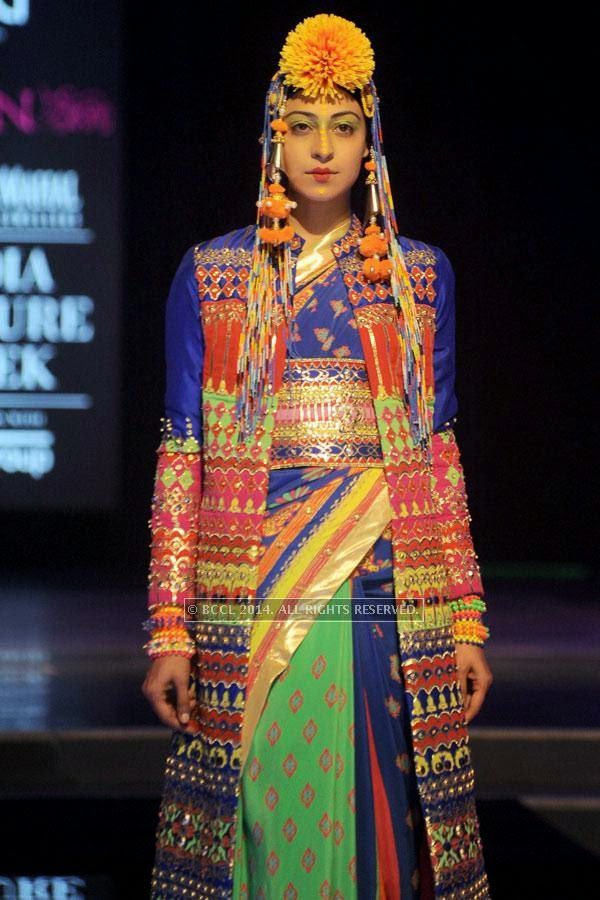 A model walks the ramp for designer Manish Arora on Day 3 of India Couture Week, 2014, held at Taj Palace hotel, New Delhi.