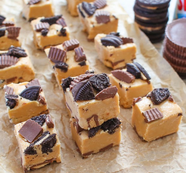 photo of Peanut Butter Cup Oreo Fudge pieces lined up on parchment paper