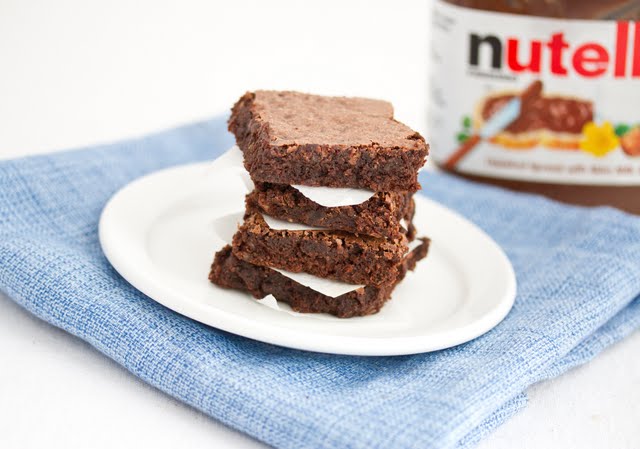 photo of a stack of Flourless Nutella Brownies on a plate