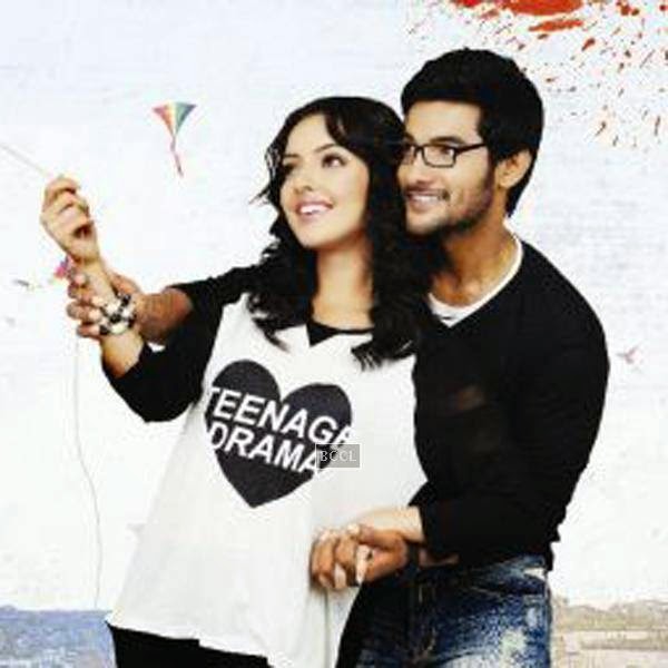 Aadi and Erica Fernandes in a still from Telugu movie Galipatam. www.gulte.com
