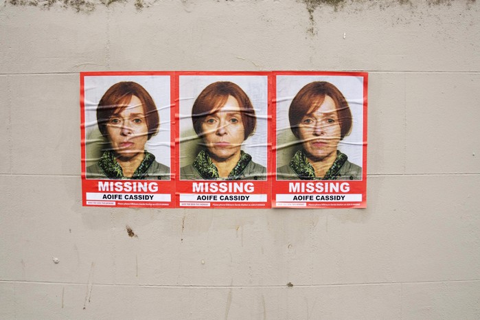 Three Aoife Cassidy missing posters plastered on a wall