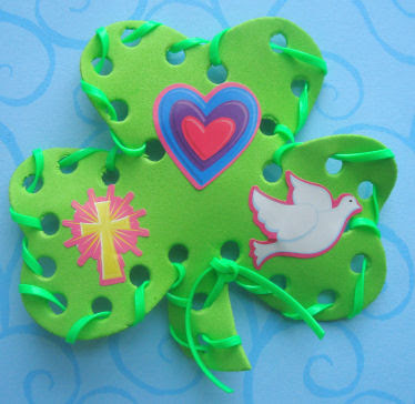 Foam shamrock with green binding with a cross, heart, and dove