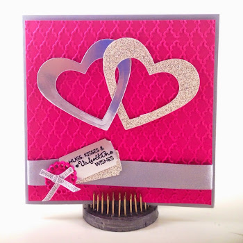 Linda Vich Creates: Hugs, Kisses and Valentine Wishes. Traditional Stampin' Up! Valentine card with two intertwined silver hearts, nestled on a Fancy Fan embossed matte, finished off with silver ribbons, button and sentiment stamped on a silver ticket.