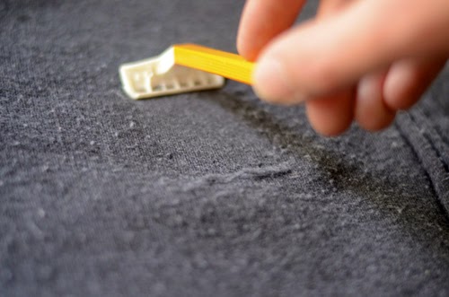 One of the best ways to depill winter coats and sweaters is by gently rubbing them with a pumice stone then removing them with a lint roller