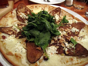 Deschutes Brewery Portland Pub, grilled washington pear and goat cheese pizza with Spent Grain Dough topped with Pears, Goat Cheese, Mozzarella and Hazelnuts. Topped with Fresh Arugula tossed in White Balsamic Dressing, Portland