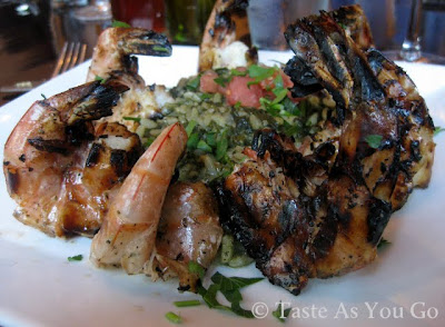 Charcoal-Grilled Shrimp over Spanakorizo at Dafni Greek Taverna in New York, NY - Photo by Taste As You Go