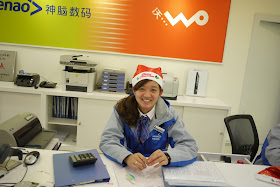 young woman wearing a Santa hat in Putian, China