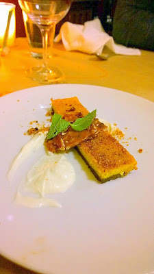 Dessert at our Thanksgiving Dinner at the girl & the fig of Pumpkin Cheesecake with chocolate graham cracker crust, creme fraiche, and pumpkin seed brittle