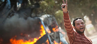 Gadhafi vows 'long war' as strikes hit his forces