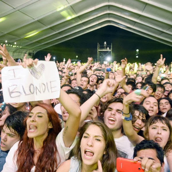 Fans of US singer Blondie enjoy the performance during the first day of Corona Capital Music Fest at the Autodromo Hernmanos Rodriguez, in Mexico City, on October 12, 2013.