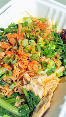 Mii Gai, egg noodles with housemade sweet and savory Mii sauce topped with chicken, ong choy, fried garlic/shallots, scallions and crispy chicken skin from Haan Ghin, a Laotian Food Cart in Portland