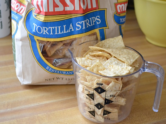tortilla strips in measuring cup with full bag in background 
