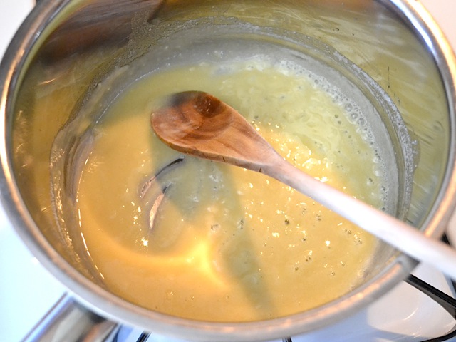 flour added to butter and garlic in pot to make roux 