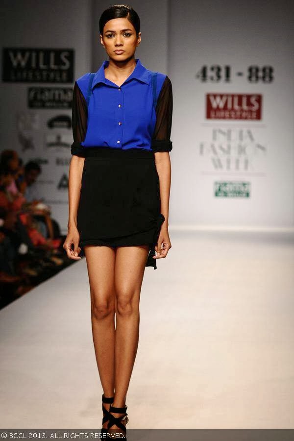 A model walks the ramp for fashion designer Shweta Kapur on Day 5 of Wills Lifestyle India Fashion Week (WIFW) Spring/Summer 2014, held in Delhi.<br /> 