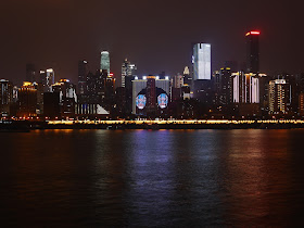 view of Jiefangbei, Chongqing, and some of its surrounding area as seen from across the Yangtze River at night