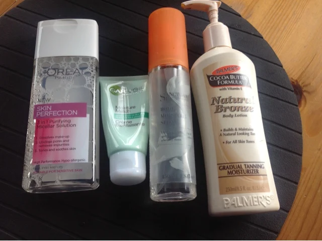 flat lay of products Loral skin perfection santucuary spa and more 