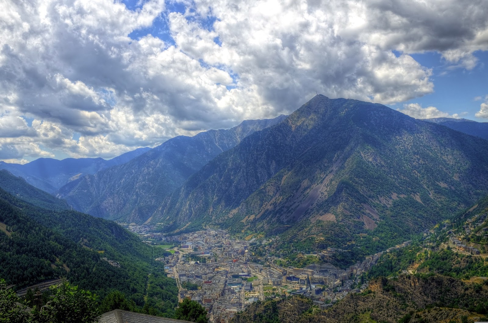 view of andorra valley with blue sky and clouds
