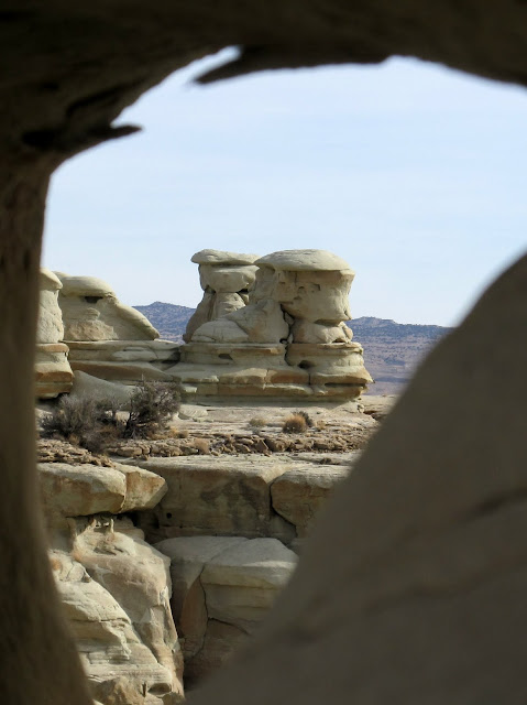 Curtis Formation rocks viewed through a small arch