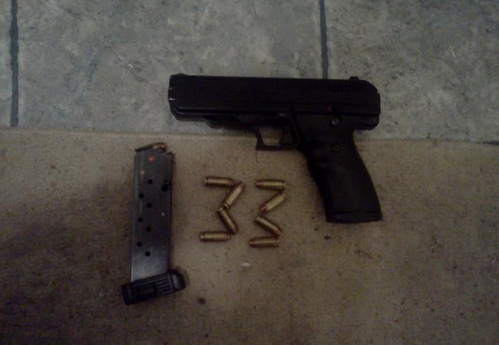 13-year-old Jarell Tucker's automatic hand-gun and ammunition. 13-year-old Jarell Tucker's automatic hand-gun and ammunition.